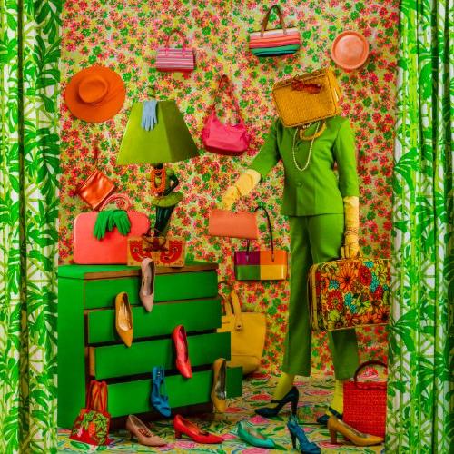 Highly patterned image of a standing figure with a purse over their head. They are holding several bags, and are surrounded by shoes. There are hats and bags on the wall behind them. A green dresser to the left had high heels coming out of the drawers.