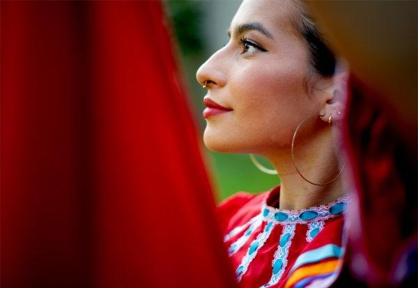 Student Giselle Torres dances with members of Monarcas.