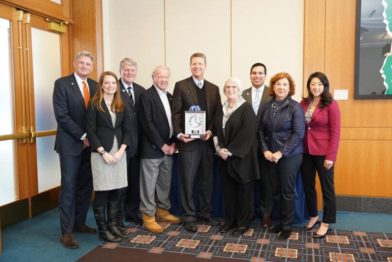 David Hooker, pictured with members of the GVSU Board of Trustees, President Thomas J. Haas and Robert Hooker.