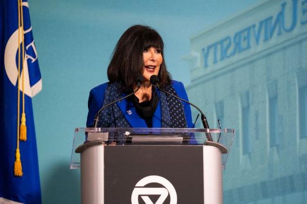 GVSU President Philomena V. Mantella giving remarks at a podium.