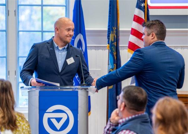 Shane Scherer shakes hands with student veteran Caleb Worpel