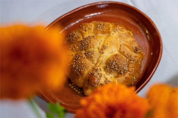 Pan de muerto (bread of the dead) at the Día de Muertos (Day of the Dead) altar in the Office of Multicultural Affairs