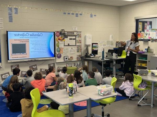 Mikayla Durham, who spent the fall semester as a student teacher, discusses a lesson in class with her students. 