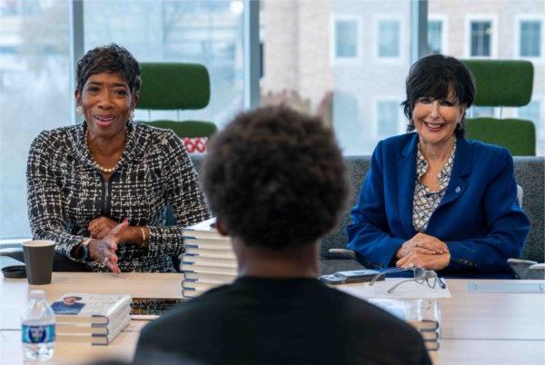  President Philomena V. Mantella and Carla A. Harris speak to students.