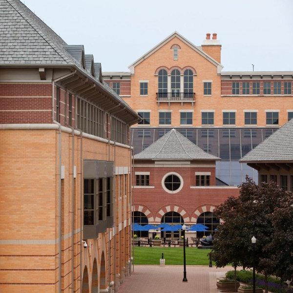 exterior view of the DeVos Center, with green grass in the center