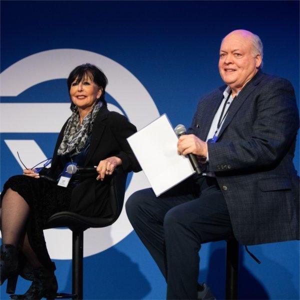 Jim Hackett and President Philomena V. Mantella answer questions from audience members during their Fireside Chat.