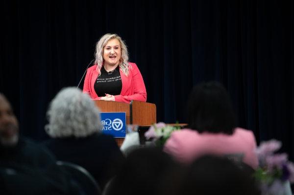 Faith Kidd, president of Student Senate, speaks from a podium