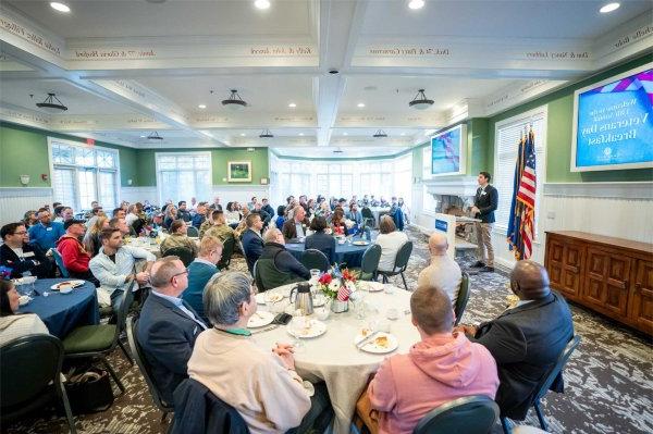 Nick Adams, a fellow at the Peter C. Cook Leadership Academy and a former Marine, speaks during the 13th Annual Veterans Breakfast.