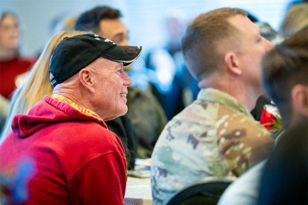 Attendees of 13th Annual Veterans Breakfast listen to a speaker.