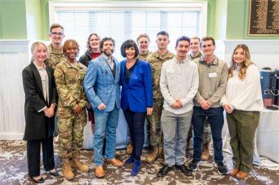 President Philomena V. Mantella and guest speaker Jason Redman pose for a photo with members of GVSU's ROTC.