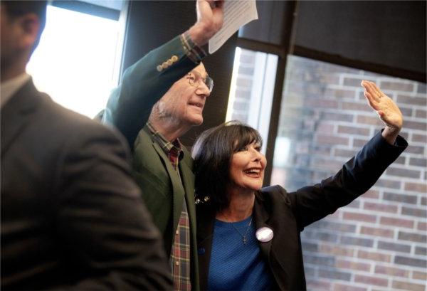 President Mantella and Bob Thompson wave to students