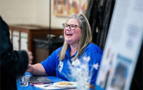 Bonnie Jaracz, assistant director for TRIO Pre-College Programs, laughs with students