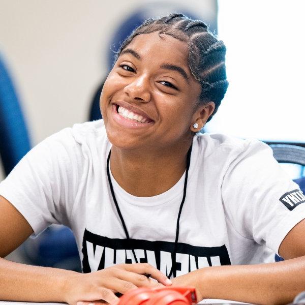 Student smiles for a photo during College Prep Week event.