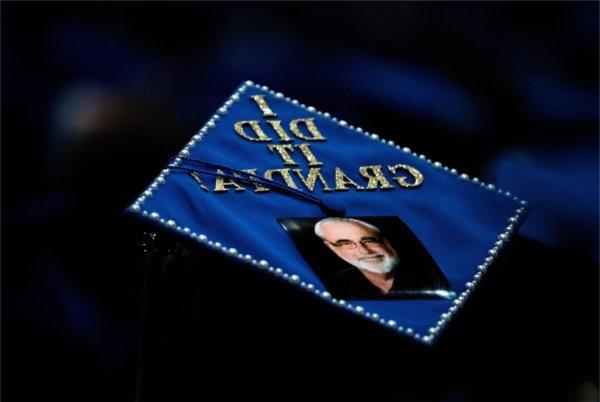 The top of a graduation cap that reads "I did it Grandpa!"