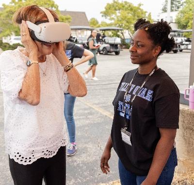 Joan Secchia tries a VR experience showing a 360 degree video tour of what the Joan Secchia Children's Rehabilitation Hospital will look like when it is completed in 2026.