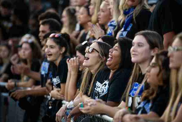 The student section cheers during a college football game.  