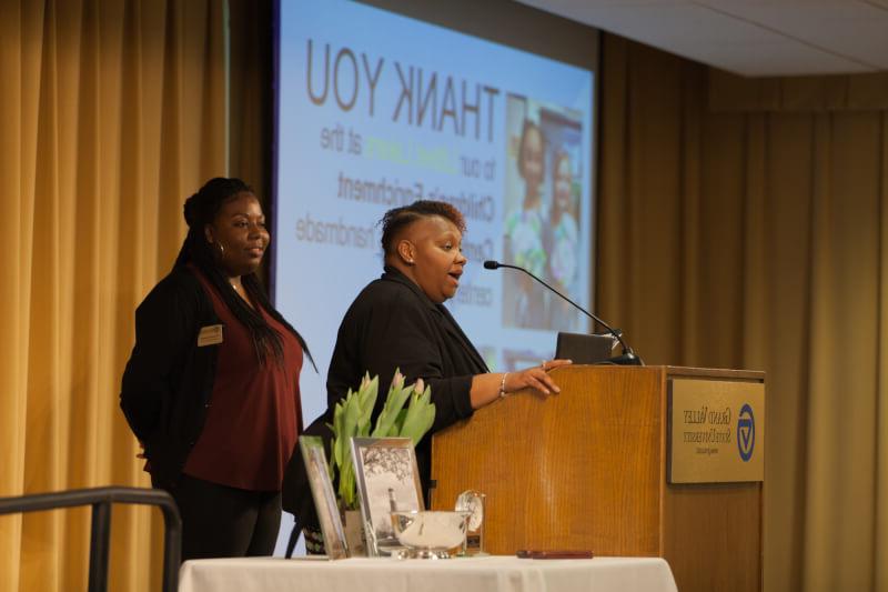 two women at podium