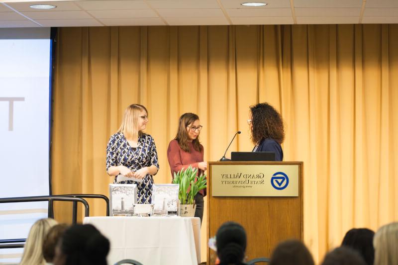 three women on stage