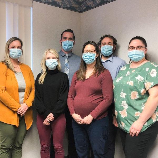 From left to right are Brittany Oehlers, Christopher Laninga, Debra Swoverland, Jay Gillespie, Lara Gavaldon and Lindsey Banktson. All are wearing masks and pictured inside a conference room.