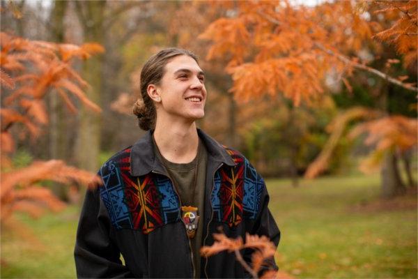 GVSU Senior, Simon Baker poses for a portrait outdoors on campus. 