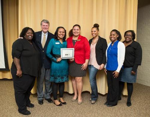 President Thomas J. Haas is pictured with members of Positive Black Women and a scholarship recipient at last year's event.