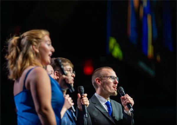  A singing group performs during a commencement ceremony. 