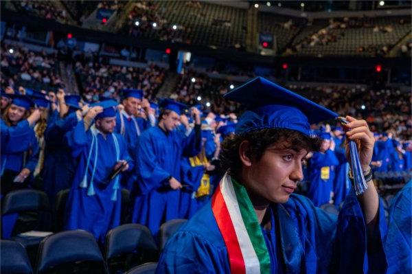  A graduate moves their tassel from right to left to signify their graduation.