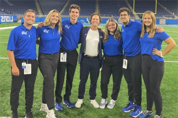 Annabel Gerrity with coworkers at Ford Field.