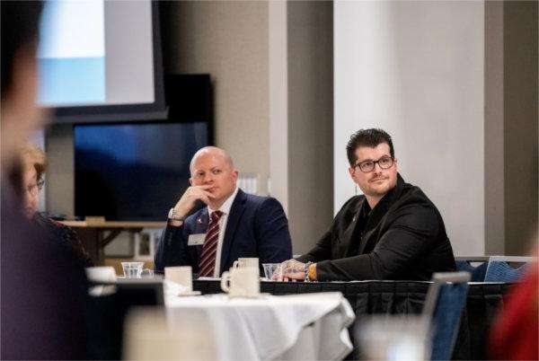 Cody Kirby, left, and Daniel Montanera discussed the statistical look at the state of the region's health during the Health Care Economic Forecast at the DeVos Center for Interprofessional Health February 7.