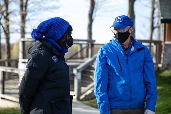 Peter Wampler, left, talks with President Philomena V. Mantella.