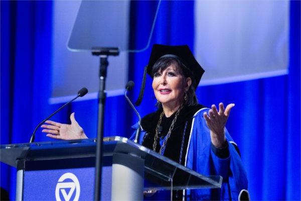  A university president speaks at a lectern. 