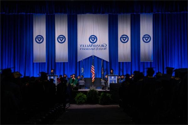  A university president speaks at a lecturn during Commencement.