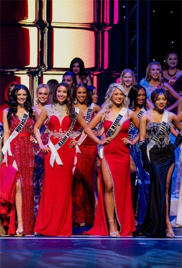 Miss Michigan USA candidates stand onstage during competition.