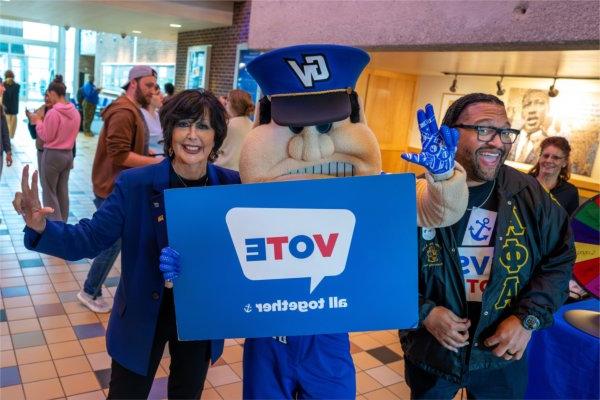 President Philomena V. Mantella, Robert Shorty and Louie the Laker pose for a picture as part of an event at the Kirkhof Center encouraging the GVSU community to vote on November 5. Shorty is vice president for People, Equity and Culture.