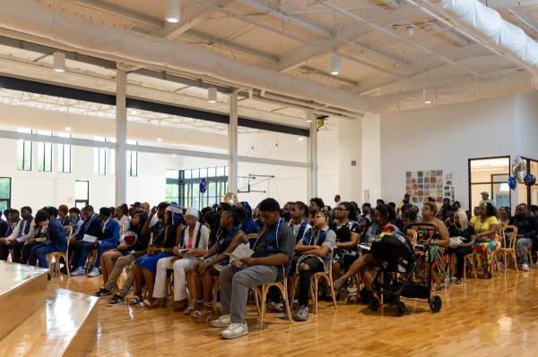 students and their supporters are seated for an eighth grade promotion ceremony at Detroit Achievement Academy