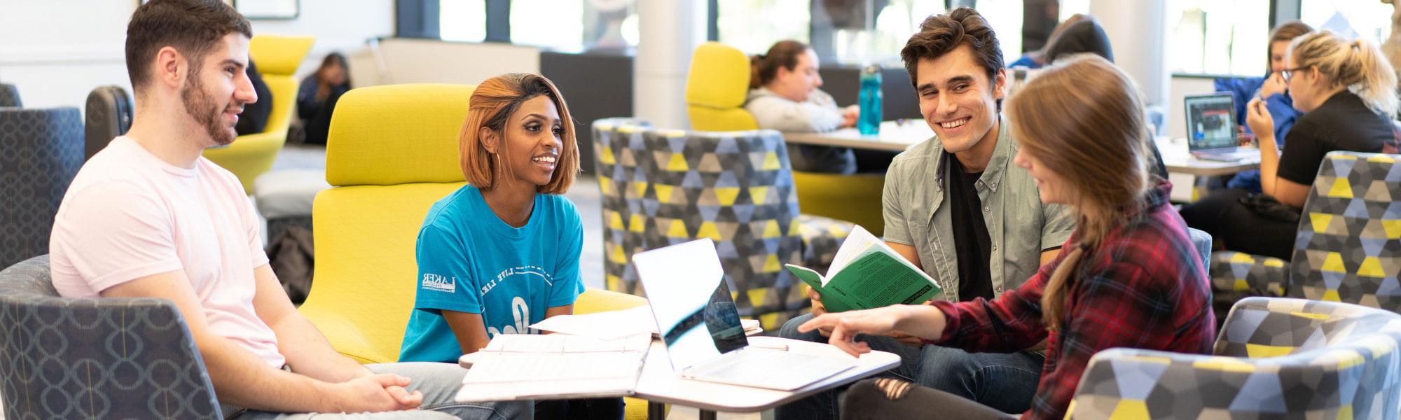 A group of GVSU students studying on campus.