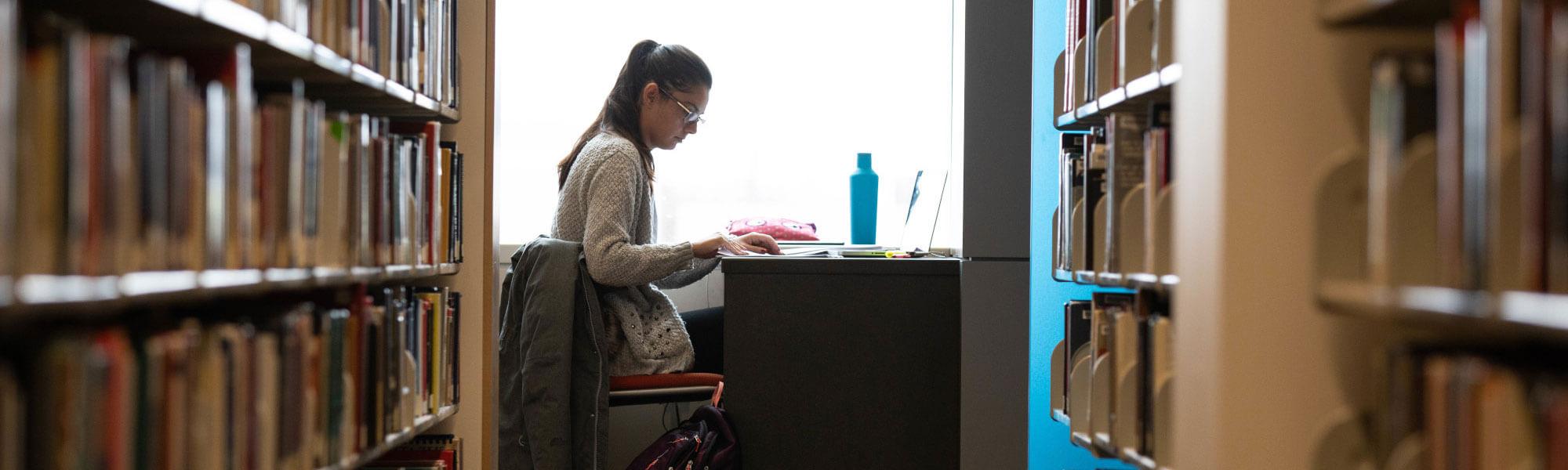 GVSU student at work in the Mary Idema Pew Library.