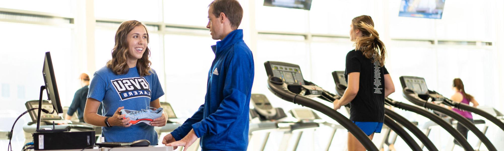 GVSU exercise science student and professor engaged in a running shoe study.